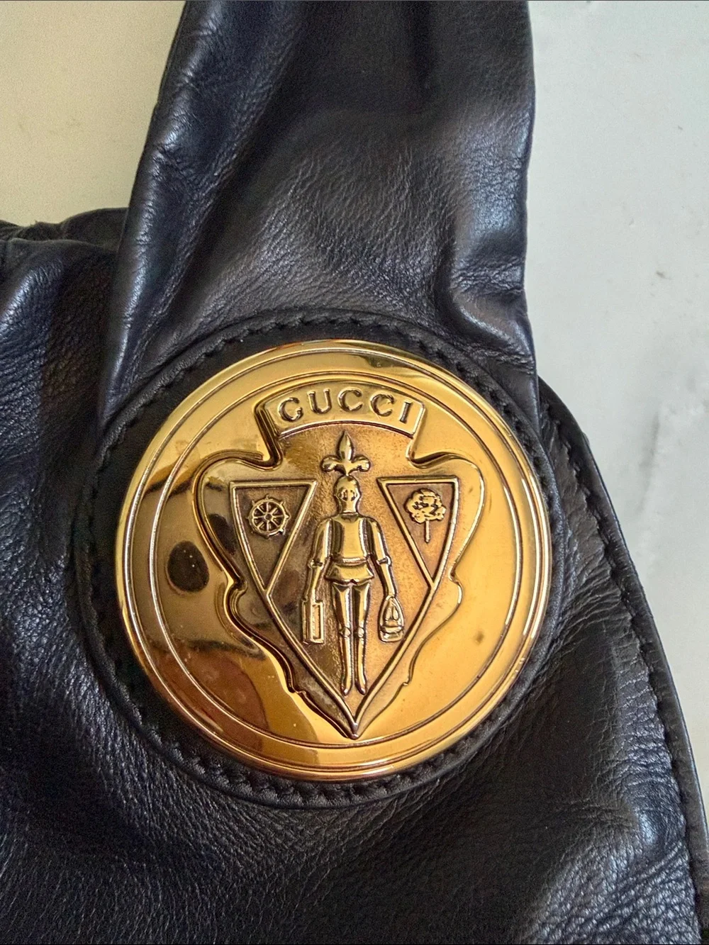 Gucci Black Leather Hobo Bag with Gold Medallions